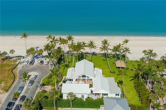 aerial view featuring a water view and a beach view