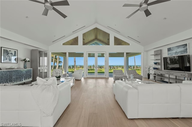 living room with french doors, high vaulted ceiling, light hardwood / wood-style floors, and ceiling fan