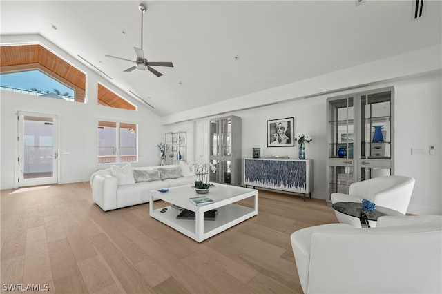 living room featuring high vaulted ceiling, ceiling fan, and hardwood / wood-style floors