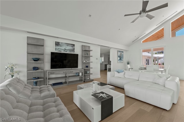 living room with high vaulted ceiling, wood-type flooring, and ceiling fan