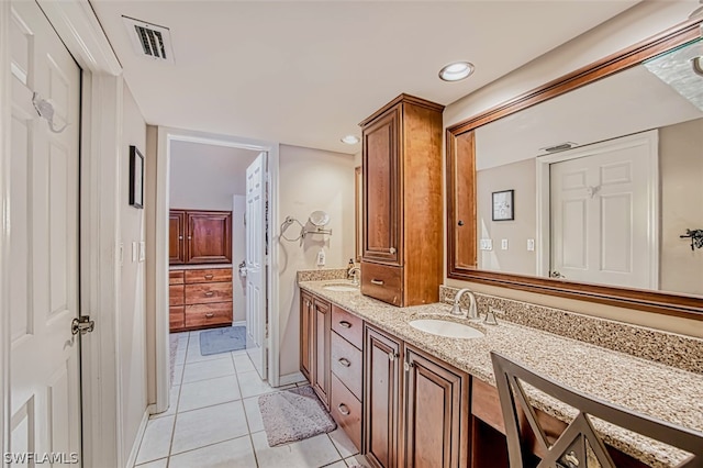 bathroom with vanity and tile patterned floors