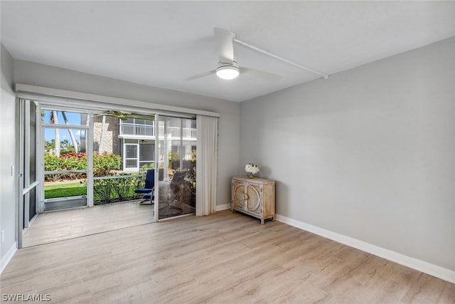 empty room featuring ceiling fan and light wood-type flooring