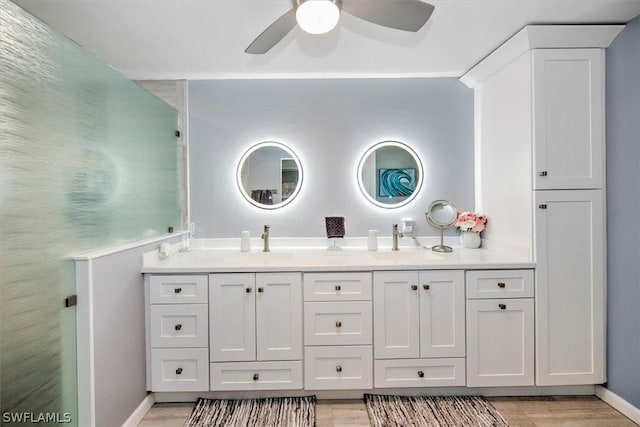 bathroom featuring vanity, hardwood / wood-style flooring, and ceiling fan