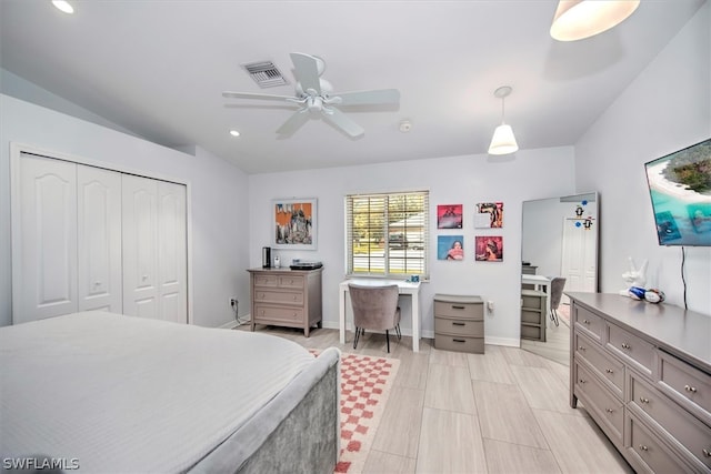 bedroom with ceiling fan and a closet