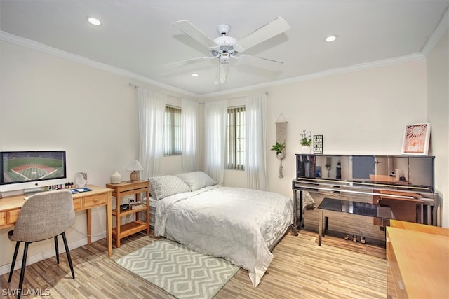 bedroom featuring ceiling fan, ornamental molding, and light hardwood / wood-style floors