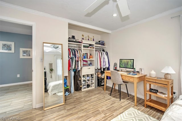 office space with ceiling fan, ornamental molding, and light hardwood / wood-style flooring