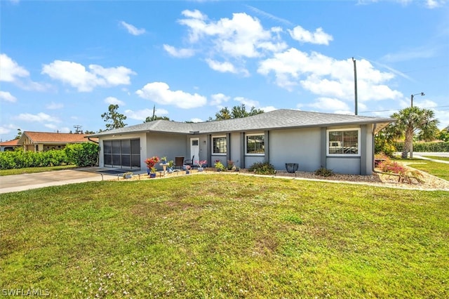 ranch-style house with a garage and a front lawn