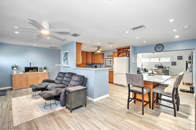 living room featuring ceiling fan