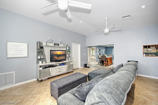 living room featuring light tile patterned floors, vaulted ceiling, and ceiling fan