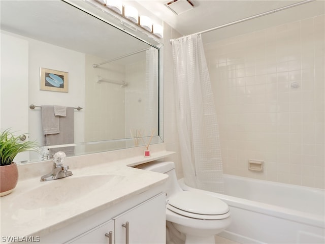 full bathroom featuring vanity, toilet, and shower / bathtub combination with curtain