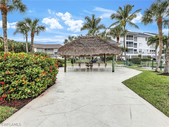 view of property's community with a gazebo and a lawn