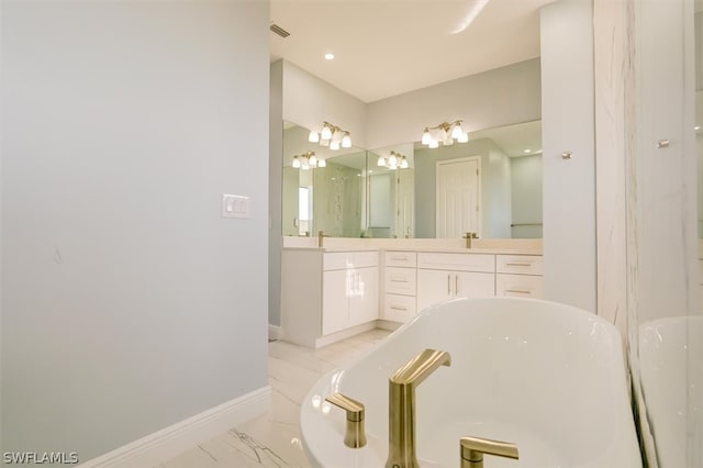 bathroom featuring a bath to relax in, tile floors, and large vanity