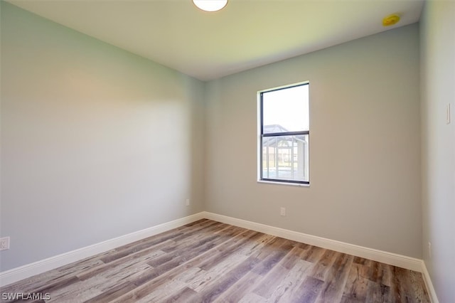 unfurnished room featuring wood-type flooring