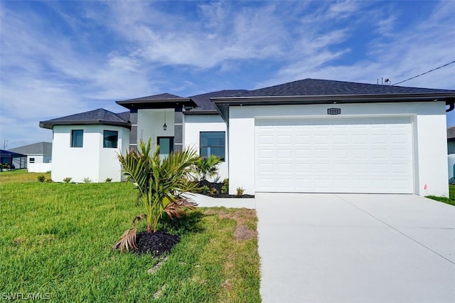 view of front of house with a garage and a front lawn