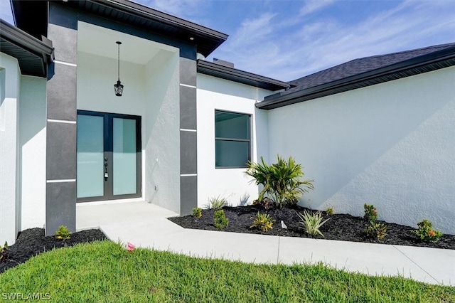 view of property exterior with french doors