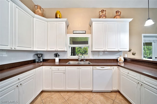 kitchen featuring white cabinets, sink, tasteful backsplash, and dishwasher