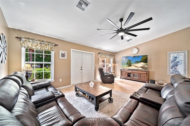 tiled living room with lofted ceiling and ceiling fan