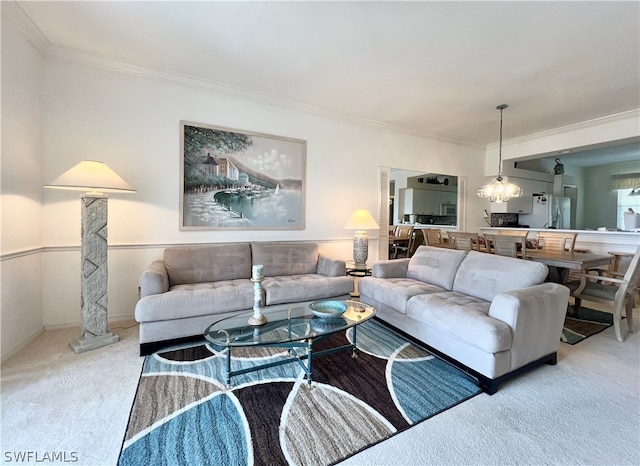 carpeted living room featuring ornamental molding and ornate columns