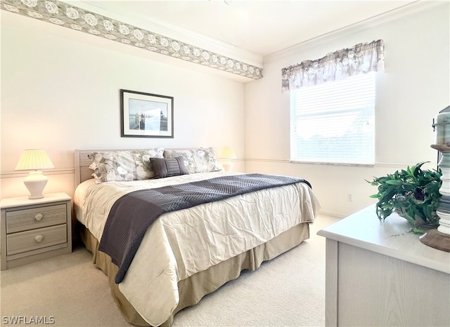 carpeted bedroom featuring ornamental molding