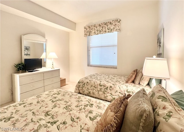 bedroom with light colored carpet