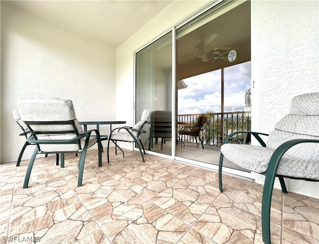 balcony featuring ceiling fan