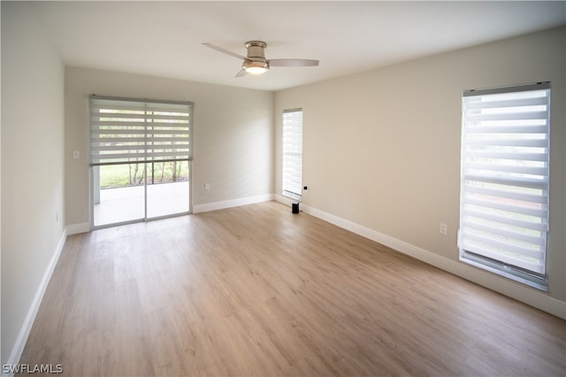 unfurnished room with ceiling fan and light hardwood / wood-style floors