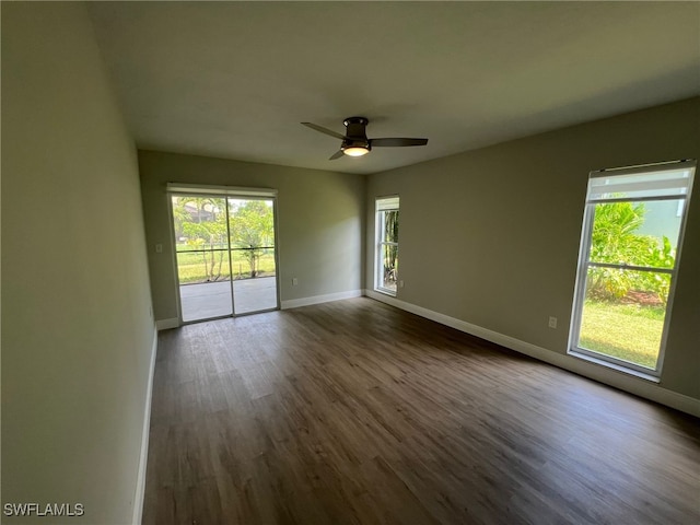 spare room featuring ceiling fan and hardwood / wood-style floors