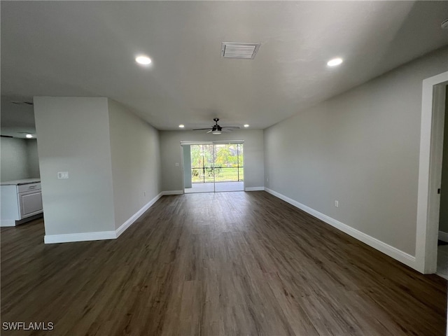 interior space with ceiling fan and dark hardwood / wood-style flooring