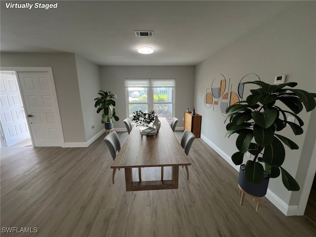 dining space featuring hardwood / wood-style flooring