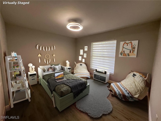 bedroom featuring dark hardwood / wood-style floors