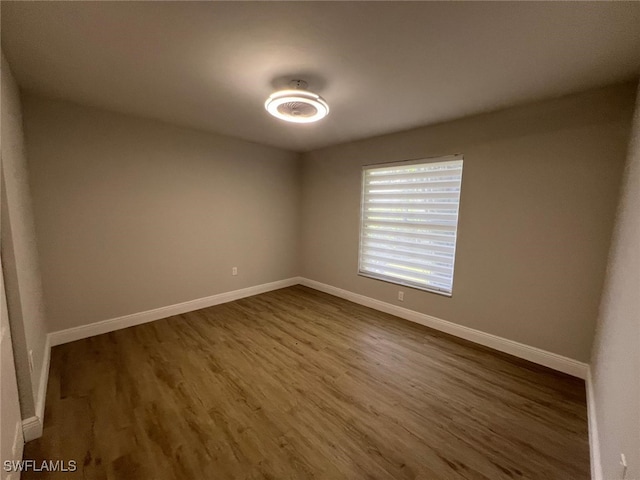 unfurnished room featuring hardwood / wood-style floors