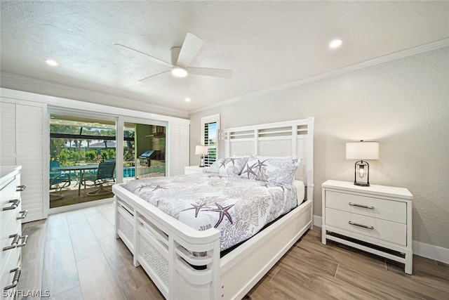 bedroom featuring light hardwood / wood-style flooring, ceiling fan, crown molding, and access to outside