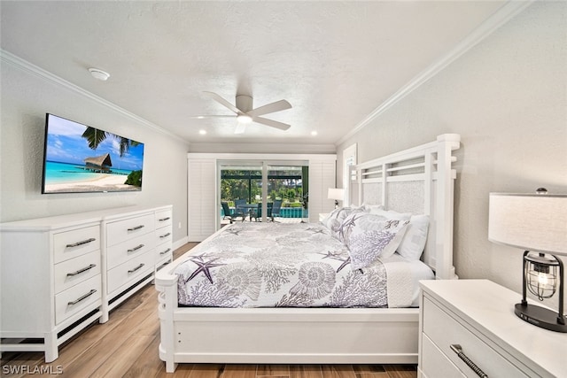 bedroom with hardwood / wood-style flooring, ornamental molding, and ceiling fan