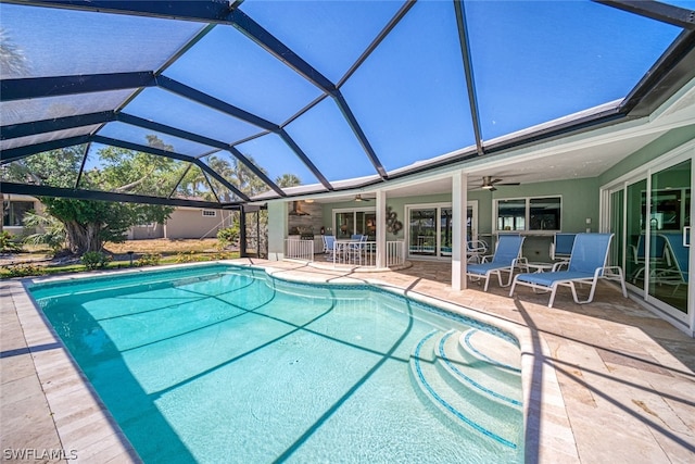 view of pool featuring ceiling fan, a lanai, and a patio