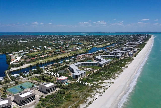 aerial view featuring a view of the beach and a water view