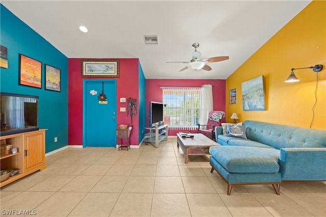 tiled living room featuring vaulted ceiling and ceiling fan