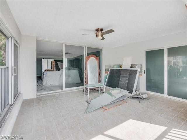 view of patio featuring ceiling fan