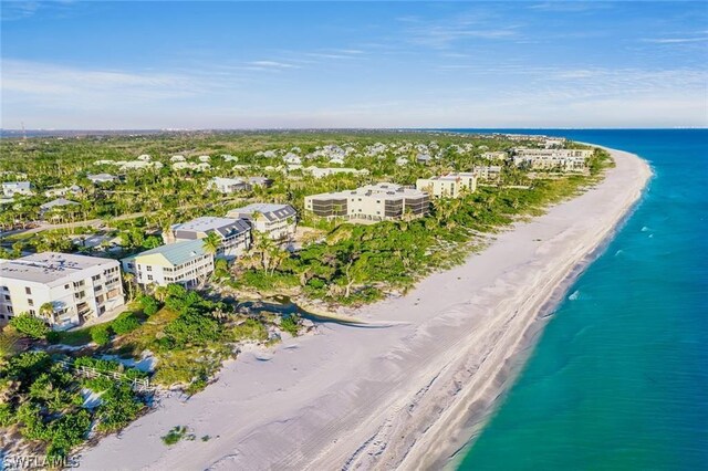 aerial view featuring a view of the beach and a water view