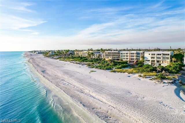 aerial view with a view of the beach and a water view