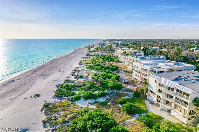 birds eye view of property featuring a view of the beach and a water view