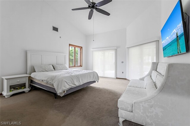 carpeted bedroom with high vaulted ceiling and ceiling fan