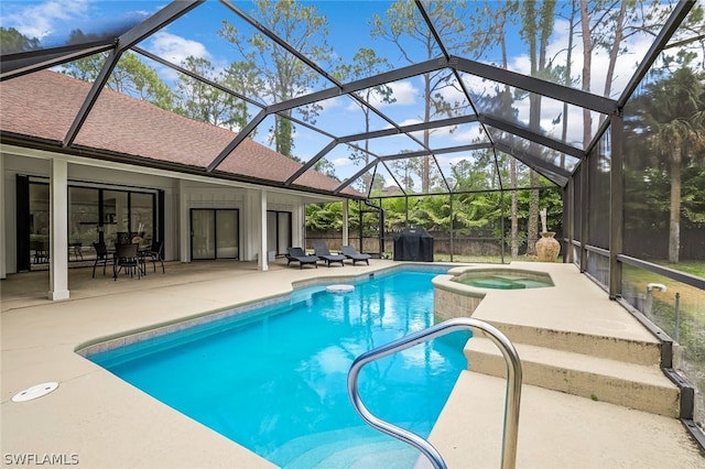 view of swimming pool featuring a lanai, an in ground hot tub, and a patio