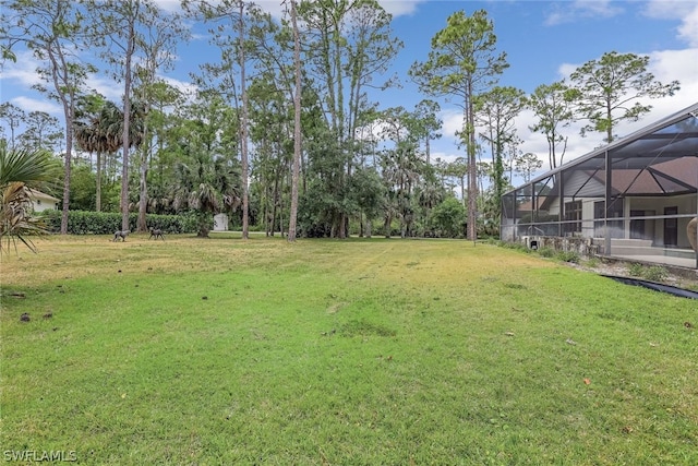 view of yard featuring a lanai