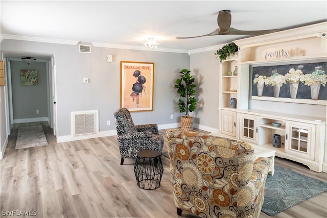 living room with ceiling fan, light hardwood / wood-style floors, and ornamental molding