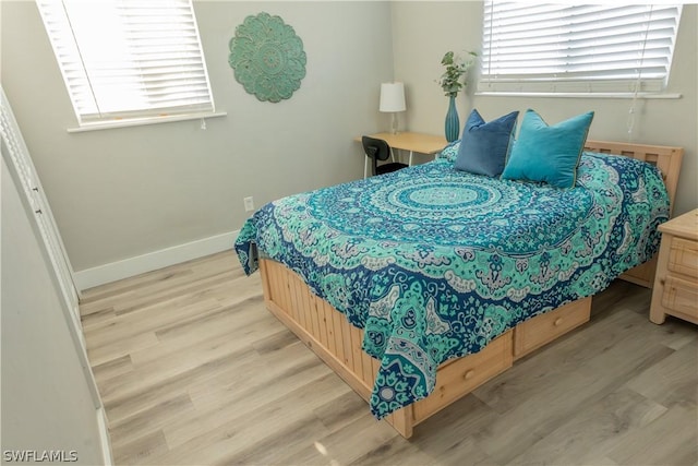 bedroom with light hardwood / wood-style floors