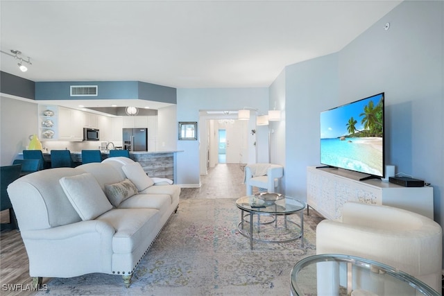 living room with light hardwood / wood-style floors