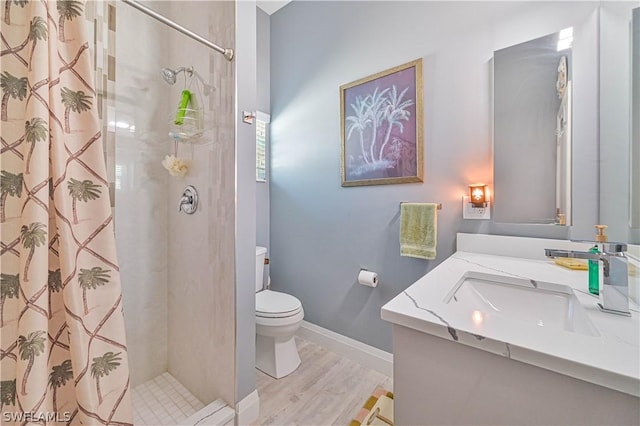 full bath featuring curtained shower, toilet, vanity, wood finished floors, and baseboards