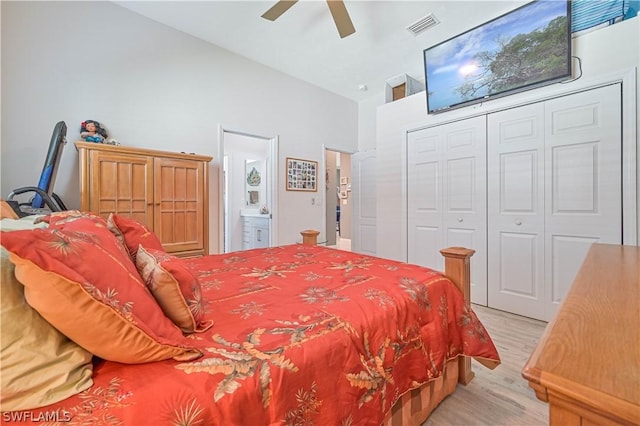 bedroom with visible vents, ceiling fan, ensuite bathroom, light wood-style floors, and a closet