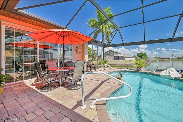 outdoor pool featuring a patio area, a lanai, and a water view