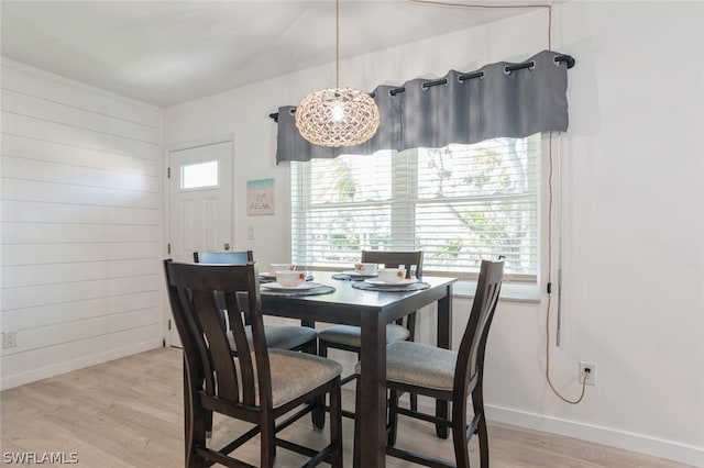 dining space with light hardwood / wood-style flooring